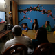 A family in India watches prime minister Narendra Modi addressing the nation during a televised address on March 27, 2019.